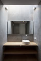 Bath Room, Ceramic Tile Wall, Two Piece Toilet, and Wall Lighting  Photo 15 of 19 in House BN by Didonè Comacchio
