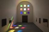 Inside, the sun shines through the colorful stained glass windows.