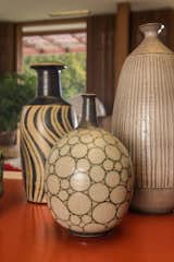 Two vases by Harrison McIntosh are displayed in the living room.