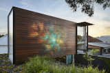 Exterior, House Building Type, Wood Siding Material, Flat RoofLine, and Green Roof Material On the exterior of the office, a mural called “Awakened Flow” by Seb Humphreys (AKA Order 55) echoes the tranquil energy of the home.  Search “안산오피DBM55.COM안산오피안산키스방 안산오피 안산오피 안산건마 안산룸클럽 안산업소 안산마사지” from An Australian Cottage Gets a Japanese-Inspired Makeover and a New Home Office