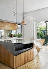 The stainless-steel and timber island maximizes space with a secret hatch that opens to add extra surface area for food prep.&nbsp;