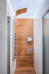 In the bathroom, a skylight above the shower welcomes in natural light.