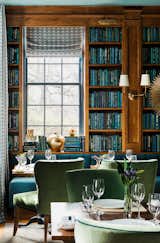 In the Library, built-in bookcases and a long banquette (upholstered in Kravet’s Versailles Velvet fabric, color E25600) were installed on the far side of the room.