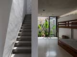 A staircase leads from the bedroom to the rooftop garden.