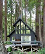 San Francisco–based couple Brit and Daniel Epperson renovated this 1974 A-frame in Sonoma, California. Brit, founder of&nbsp;Studio PLOW, and Daniel, the design director of Rapt Studio,&nbsp;painted the cabin’s redwood siding in a custom Sherwin-Williams black with green and blue undertones.