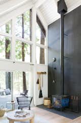 San Francisco–based architects Brit and Daniel Epperson transformed a 1974 A-frame into a bright and airy getaway, embracing certain original&nbsp;elements like the wood stove.