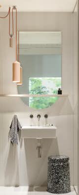 A Duravit sink is paired with a Kohler faucet.