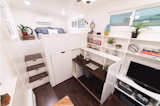 California Tiny House's custom homes offer a variety of smart space solutions like slide-out modules to tuck away desks and clothing closets.