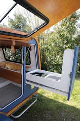 A slide-out drawer allows travelers to use the kitchen inside and outside of the trailer.