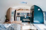 Design-build company Innovative Spaces completed a top-to-bottom restoration of this 1973 Airstream Tradewind for a solo adventurer who was ready for life on the open road with her cat and dog in tow. Interior designer Lauren Ravenhill of LF Design Studio worked with the client to find timeless finishes that jibed with her aesthetic, such as maple flooring and shelves.