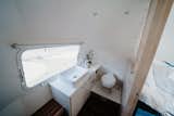 The bathroom and the kitchen feature Glacier White Corian countertops.&nbsp;