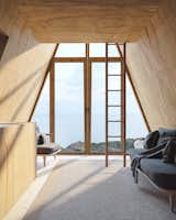 Shed & Studio and Living Space Room Type A ladder leads from the open first floor to the lofted sleeping area in Den's Bunk Cabin.  Photo 7 of 13 in A DIY Cabin Brand Is Selling $99 A-Frame Plans