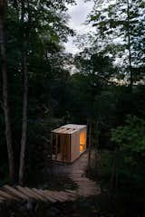 The sauna structure includes a small deck.