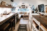 Interior designer Markie Miller and her dad, Lance Price—the woodworker behind Ironwood Furniture Co.—joined forces to revamp a run-down 1972 Airstream Sovereign Land Yacht. "This was a special father-daughter project for a couple of people who have a habit of falling in love with things that need fixing," Markie says. Inside the 200-square-foot space, Lance’s wood-and-metal furnishings—the banquette, bed frame, shelving, cabinetry, and countertops—take center stage.
