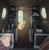 The boat’s cabin is split into two distinct areas—the kitchen and the dining area/bedroom.