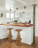 "Design choices, such as heavy bar stools in the kitchen, were made to ensure the boat could function well docked or at sea," Lyndsay says.&nbsp;