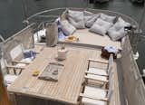 "The top of the boat was all storage, and I knew I wanted to make it into a larger outdoor space for entertaining," Lyndsay says. The new rooftop deck provides space for sunbathing and dining upstairs.