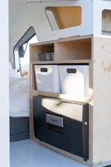The kitchenette is located in the boot of the camper, and it includes additional storage.
