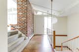 The floors throughout the home were either torn up or brought back to life. The oak wood flooring in the entryway was refinished.