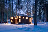 A shou sugi ban exterior echos the texture and colors of the property's forested backdrop.