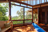 From the house, there’s 170-degree views of the ocean, as its perched above the palms. Its height allows the family to feel the ocean breeze, and the unique design of the roof allows passive cooling.