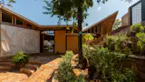 “We wanted to use the wattle and daub method and this wall highlights the artistic options of such a method,” Michelle says of the architectural exterior accent wall. “We also love the Mexican candy de la Rosa.”