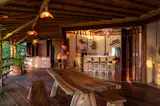 Exotic hard woods were purchased from a family nearby in the mountains and used to build the home — Cedro Cimaron for the beams, Chico Zapote for decking, and blonde  Macuil for trim, doors and other accents throughout the home.