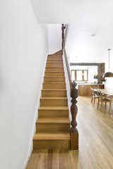Stairs from parlor floor to second floor, with original railing.