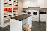 This space features dark countertops to hide spills and messes, and white cabinetry to bring the room to life. 

See more additions at http://www.casecharlotte.com/work/home-addition-charlotte/