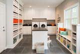 A mix of open and closed shelving gives the homeowner freedom to reinvent this laundry room addition with changing seasons. 

See more additions at http://www.casecharlotte.com/work/home-addition-charlotte/