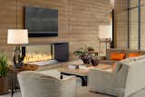 Living Room, Chair, Sofa, Sectional, Floor Lighting, Table Lighting, End Tables, Coffee Tables, Concrete Floor, Two-Sided Fireplace, and Gas Burning Fireplace  Photo 15 of 34 in Dancing Light by Brent Kendle / Kendle Design Collaborative