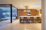 Kitchen, Limestone, Quartzite, Recessed, Wood, Refrigerator, Microwave, Cooktops, Range Hood, Wall Oven, and Undermount  Kitchen Cooktops Wall Oven Limestone Wood Quartzite Photos from Rammed Earth Modern