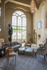 Living Area: The interior brings together exquisite details, including a magnificent stone fireplace, soaring cathedral window and captivating ceiling design in the living room.