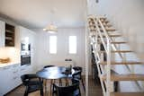 Dining Room, Table, Chair, Shelves, Pendant Lighting, Recessed Lighting, and Medium Hardwood Floor  Photo 9 of 15 in Fusion of Modern Minimalism and Family Heritage by Studio Bunyik