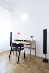 Office, Study Room Type, Chair, Desk, Lamps, Light Hardwood Floor, and Shelves Home office corner  Photo 7 of 15 in Fusion of Modern Minimalism and Family Heritage by Studio Bunyik