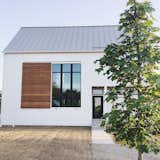 Exterior, House Building Type, and Metal Roof Material We took inspiration from modern, scandinavian, and farmhouse design to achieve our very own style. The simple "box" shape helped keep costs in check while the large windows, metal roof, and large ipe shutter created the perfect amount of interest.  Photo 1 of 7 in The Simply Simple Home by Kelsey Johnston