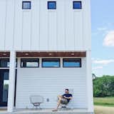 Exterior, House Building Type, Wood Siding Material, and Metal Roof Material The front porch features ipe shiplap siding which ties in nicely with the ipe shutter.  Photo 2 of 7 in The Simply Simple Home by Kelsey Johnston