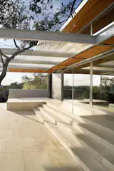 Terrace and trellis at Stonehedge Residence by Miró Rivera Architects