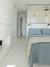 Master suite with the shower as a headboard