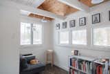 Living Room, Sofa, Bookcase, Storage, Stools, Shelves, Pendant Lighting, Dark Hardwood Floor, and Accent Lighting  Photo 9 of 9 in White's Way Cabin by Kaitlyn Payne