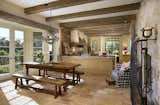 Kitchen, Granite Counter, Wood Cabinet, Ceiling Lighting, and Ceramic Tile Floor Dining area and kitchen.  Photo 4 of 14 in French Country Style by Giffin & Crane