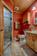 Bath Room, Granite Counter, Ceramic Tile Floor, Enclosed Shower, and Wall Lighting  Photo 14 of 21 in Country's Best Mountain Home by Golden Eagle Log & Timber Homes