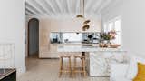 Kitchen, Cooktops, Pendant Lighting, Wall Oven, Light Hardwood Floor, Mirror Backsplashe, Colorful Cabinet, Refrigerator, Ceiling Lighting, and Drop In Sink  Photo 38 of 39 in 10 Incredible Interior Designers to Follow on Instagram Right Now