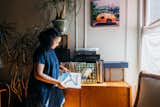 Chien filtering through her record collection. Everything has character here, even the HP Tango printer discretely tucked above the speaker.