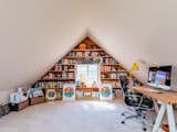 Upstairs attics and dormers are great home office ideas for small spaces. This unique home office design layout serves as both a small office and workout room for San Francisco–based knot artist Windy Chien. It also features clever storage space for the couple’s voluminous collection of books.