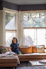 Living Room, Sofa, Pendant Lighting, and Rug Floor Chien, cozied up with her greyhound Shelly on the couch.  Photos from The Eclectic San Francisco Home of Knot Artist Windy Chien