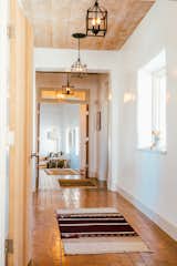 Young's obsession with textiles is apparent—vintage rugs are strewn throughout the home in an array of styles and hues.