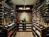 A wine cellar keeps the couple’s bottle collection cool.
