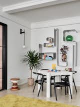 Across from the sofa area is a linen-wrapped game table for casual gatherings.