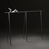 The small version of UMÉ Studio's Paper Table series in stained black with their Sake Tampo.